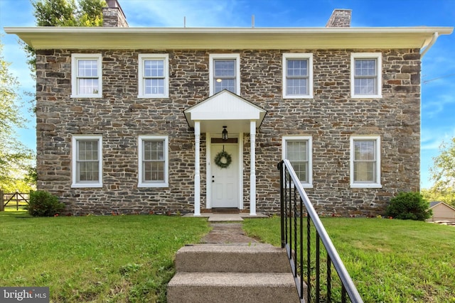 1430 S Old Bethlehem Pike, Quakertown, PA 18951 - colonial house with a chimney, stone siding, and a front yard