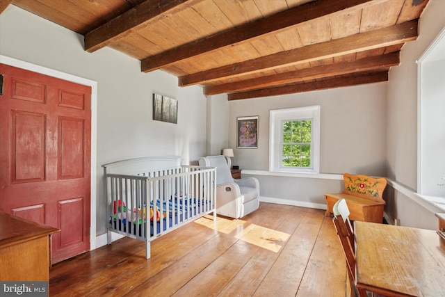 1430 S Old Bethlehem Pike, Quakertown, PA 18951 - bedroom with a wooden ceiling with exposed beams, wood-type flooring, and a crib