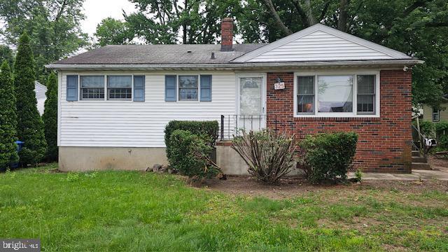 325 Lincoln Ave, Maple Shade, NJ 08052 - bungalow-style home featuring a front yard, a chimney, and brick siding