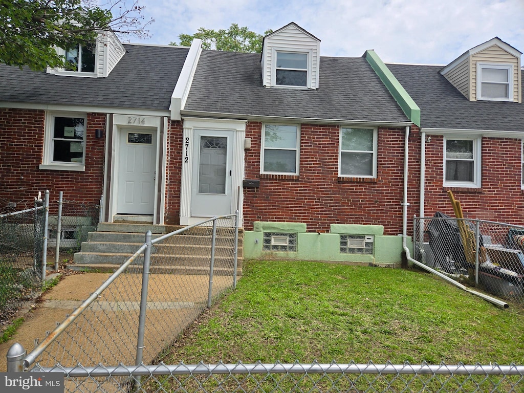 2712 Thatcher St, Wilmington, DE 19802 - view of front of property featuring entry steps, a fenced backyard, brick siding, and roof with shingles