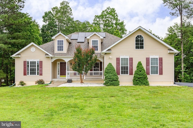 4049 Chatham Dr, King George, VA 22485 - view of front of home featuring a porch, solar panels, a front lawn, and roof with shingles