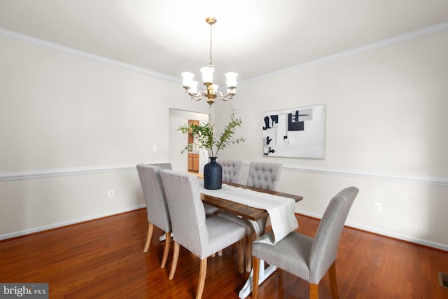 4049 Chatham Dr, King George, VA 22485 - dining area with a chandelier, ornamental molding, and wood finished floors