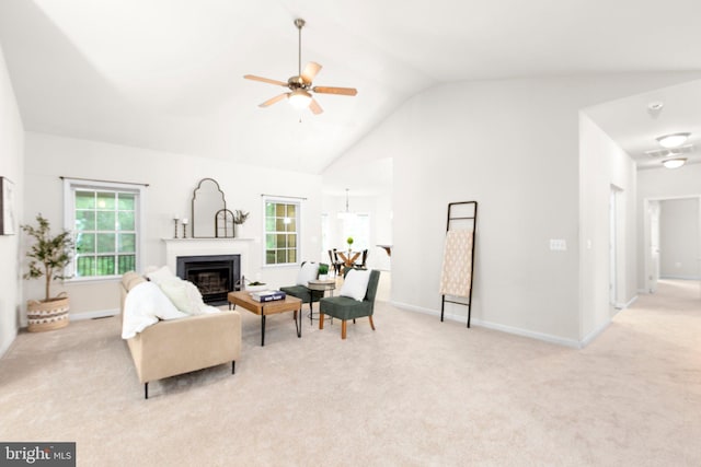 4049 Chatham Dr, King George, VA 22485 - living area with light carpet, a ceiling fan, a glass covered fireplace, and high vaulted ceiling