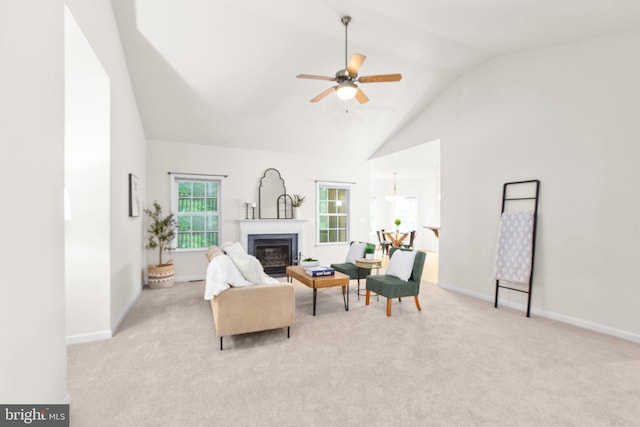 4049 Chatham Dr, King George, VA 22485 - carpeted living area featuring a ceiling fan, a glass covered fireplace, and high vaulted ceiling