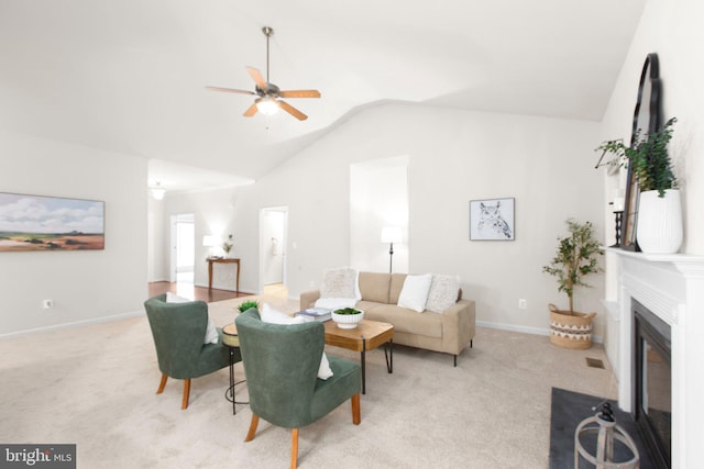 4049 Chatham Dr, King George, VA 22485 - living area featuring a ceiling fan, vaulted ceiling, carpet floors, and a fireplace with flush hearth