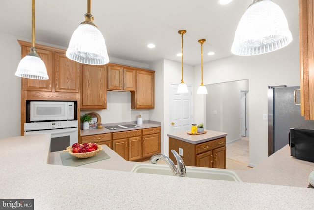 4049 Chatham Dr, King George, VA 22485 - kitchen with white appliances, light countertops, a center island, decorative light fixtures, and recessed lighting