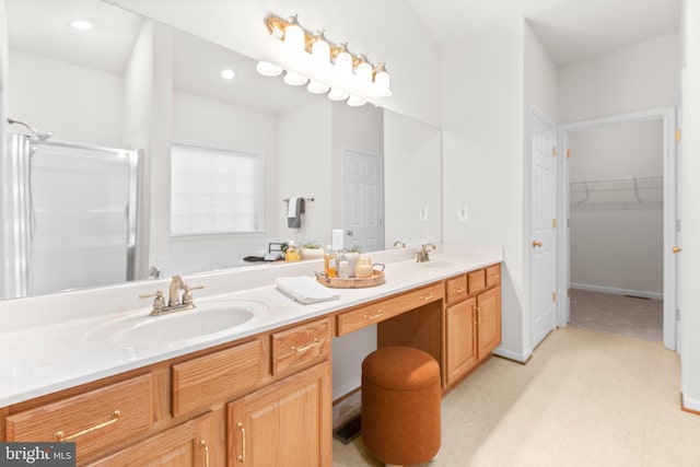 4049 Chatham Dr, King George, VA 22485 - bathroom with double vanity, a shower stall, and a spacious closet