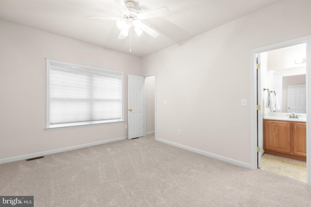 4049 Chatham Dr, King George, VA 22485 - unfurnished bedroom featuring light colored carpet and connected bathroom