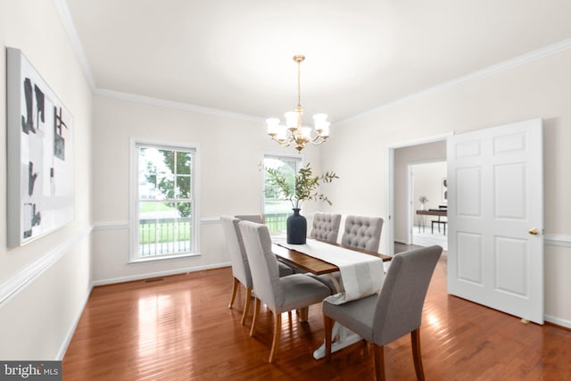 4049 Chatham Dr, King George, VA 22485 - dining area with a chandelier, crown molding, and wood finished floors