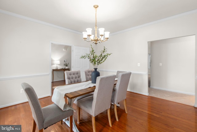 4049 Chatham Dr, King George, VA 22485 - dining room with a chandelier, ornamental molding, and wood finished floors