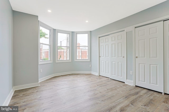 3321 N 11th St, Philadelphia, PA 19140 - unfurnished bedroom featuring wood finished floors, multiple closets, and recessed lighting