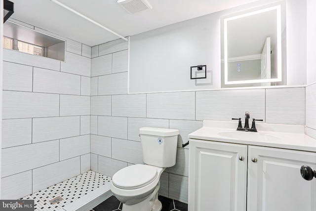 3321 N 11th St, Philadelphia, PA 19140 - full bath featuring a tile shower, vanity, and tile walls