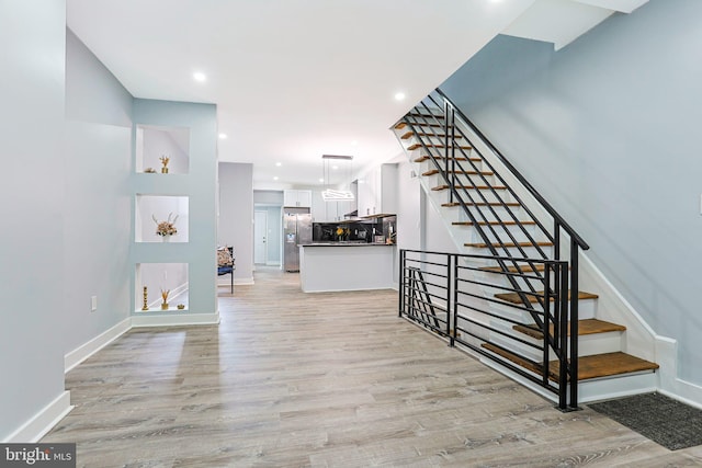 3321 N 11th St, Philadelphia, PA 19140 - stairs with wood finished floors and recessed lighting