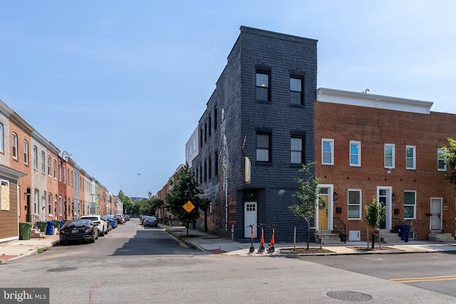 1001 S Carey St, Baltimore, MD 21223 - view of asphalt street featuring sidewalks, curbs, entry steps, and traffic signs