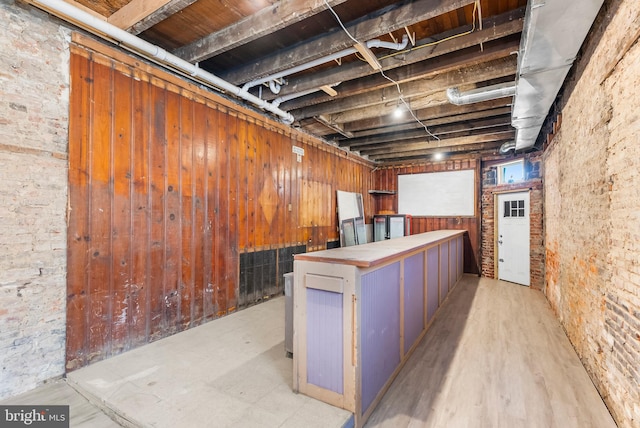 1001 S Carey St, Baltimore, MD 21223 - unfinished basement featuring wooden walls