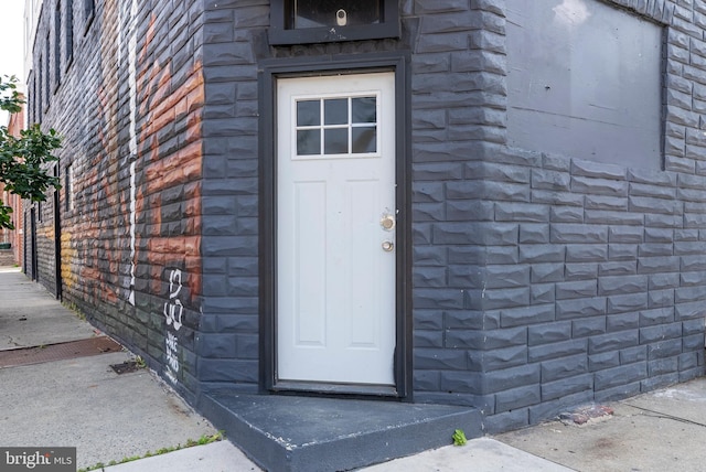 1001 S Carey St, Baltimore, MD 21223 - doorway to property featuring brick siding