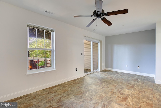 121 Quiet Waters Pl, Annapolis, MD 21403 - spare room featuring a ceiling fan and stone finish flooring