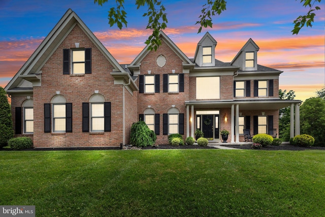 13 Buckwalter Cir, Royersford, PA 19468 - colonial home with a porch, a front lawn, and brick siding