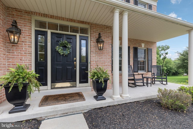 13 Buckwalter Cir, Royersford, PA 19468 - view of exterior entry featuring a porch and brick siding