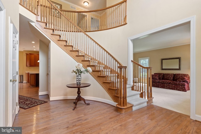 13 Buckwalter Cir, Royersford, PA 19468 - stairway with a high ceiling, wood finished floors, and crown molding