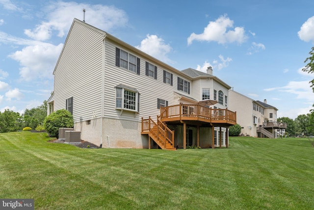 13 Buckwalter Cir, Royersford, PA 19468 - rear view of house with stairs, a deck, a chimney, and a yard