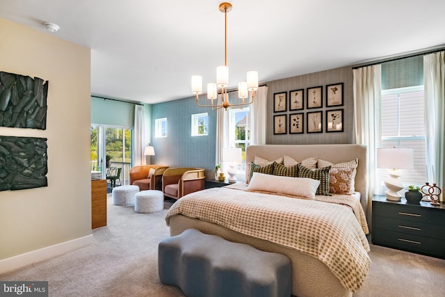 2703 Marsh Elder Dr, Cambridge, MD 21613 - bedroom featuring a chandelier, light colored carpet, wallpapered walls, and an accent wall