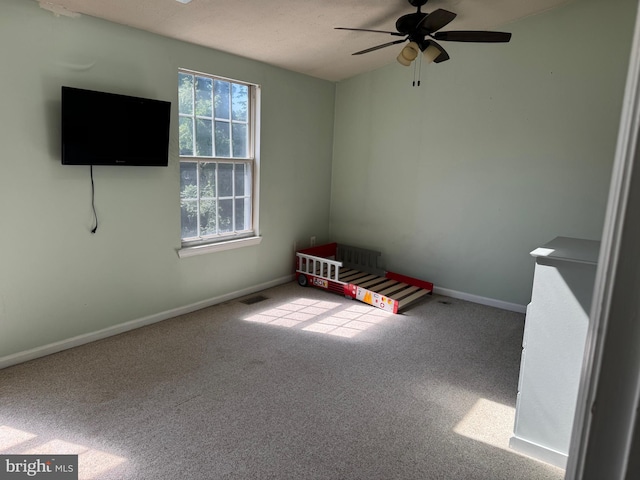 8902 Chesapeake Lighthouse Dr, North Beach, MD 20714 - unfurnished bedroom with carpet floors and a ceiling fan