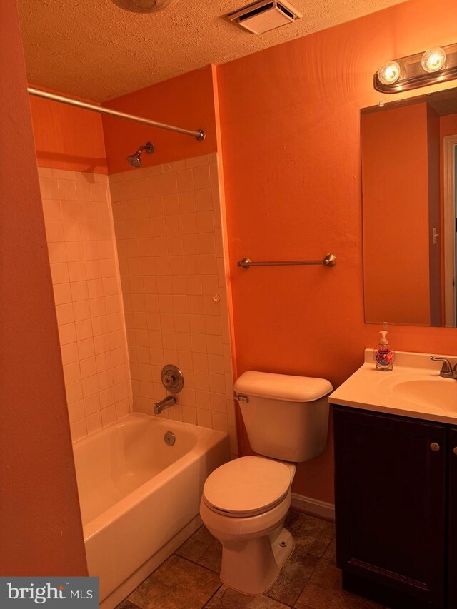 8902 Chesapeake Lighthouse Dr, North Beach, MD 20714 - full bath featuring a textured ceiling, vanity, tile patterned flooring, and  shower combination