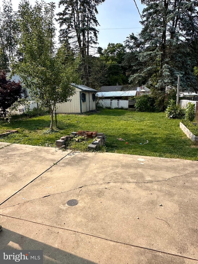 2221 Lincoln Ave, Reading, PA 19609 - view of green lawn featuring a patio area and a shed