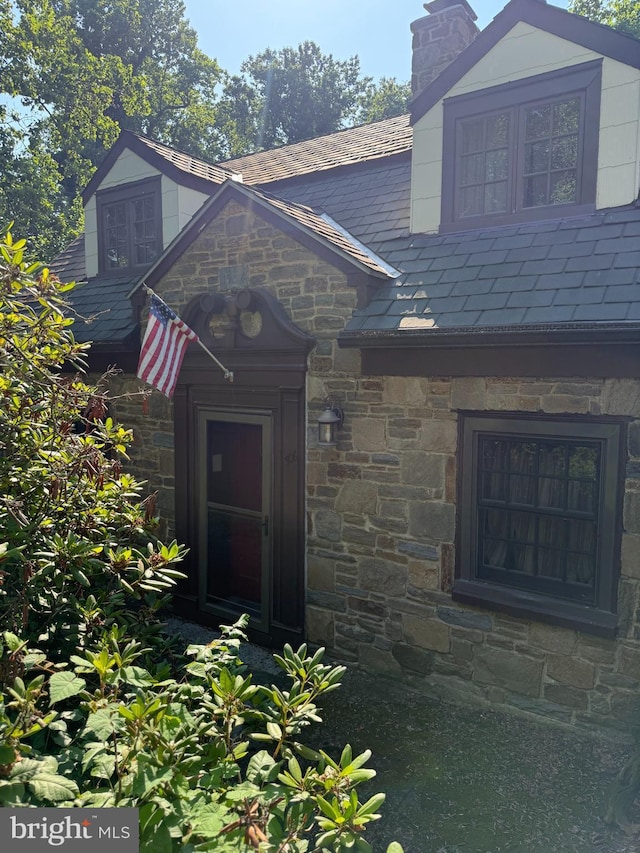 306 Euclid Ave, Wilmington, DE 19809 - entrance to property featuring a chimney, a high end roof, and stone siding