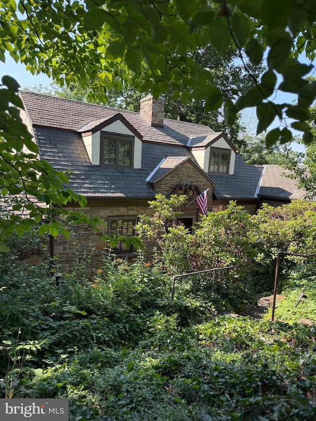 306 Euclid Ave, Wilmington, DE 19809 - view of front of property featuring a high end roof, stone siding, and a chimney