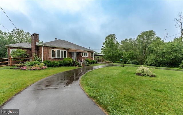 1571 Penn Dr, Andreas, PA 18211 - view of front of home with a chimney and brick siding