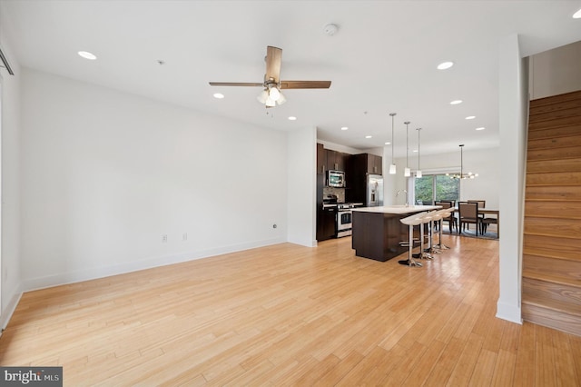 914 N Front St, Philadelphia, PA 19123 - living area with stairs, light wood finished floors, recessed lighting, and a ceiling fan