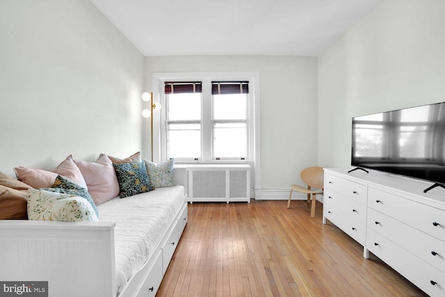 1725 17th St NW Unit 503, Washington, DC 20009 - living room with radiator heating unit and light wood finished floors