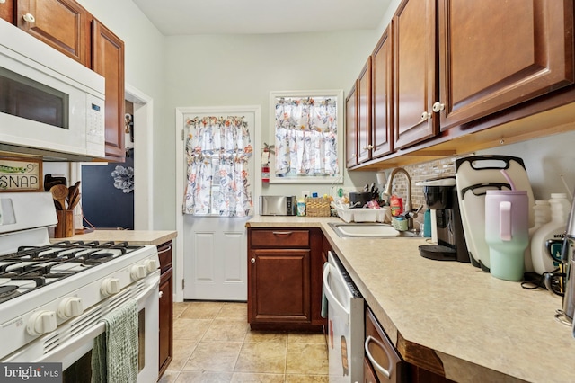 1128 Wilson Dr, Havertown, PA 19083 - kitchen featuring white appliances, light countertops, and light tile patterned flooring