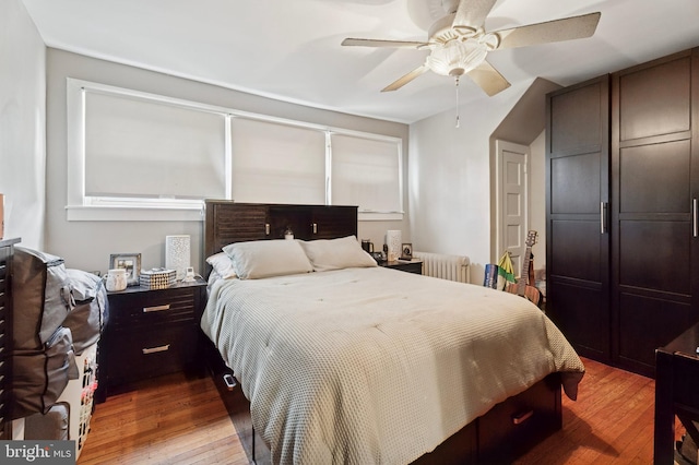1128 Wilson Dr, Havertown, PA 19083 - bedroom featuring radiator, light wood-type flooring, and ceiling fan
