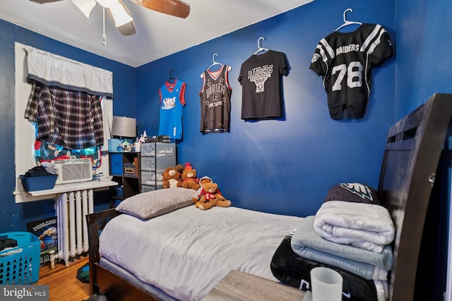 1128 Wilson Dr, Havertown, PA 19083 - bedroom with radiator, wood finished floors, and ceiling fan