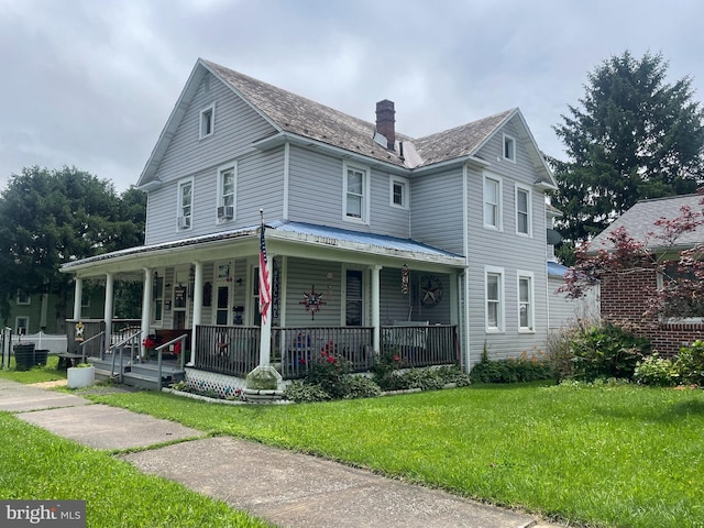 215 E Offutt St, Cumberland, MD 21502 - view of front of property featuring a chimney, covered porch, a front yard, and a metal roof