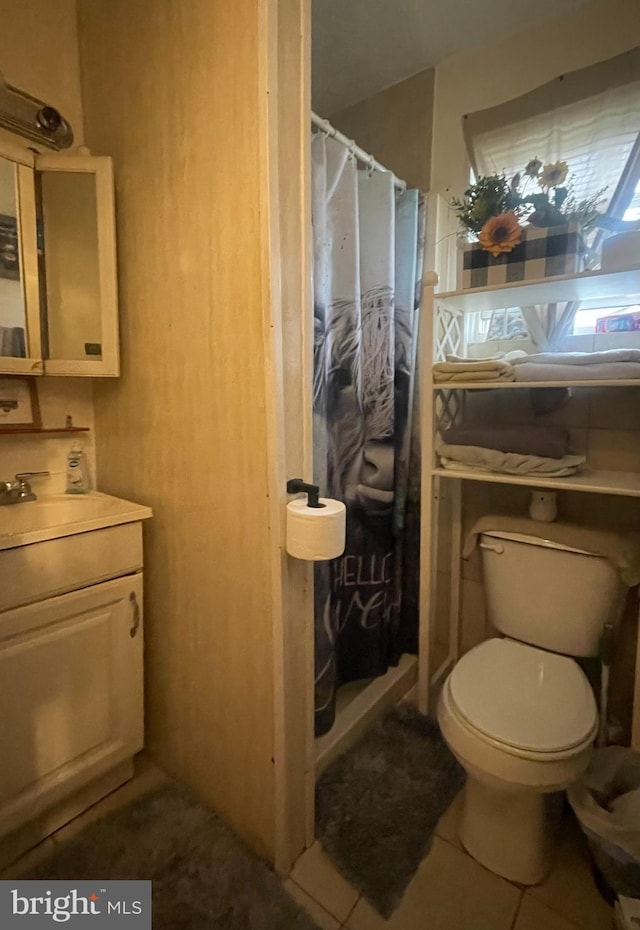 215 E Offutt St, Cumberland, MD 21502 - bathroom with vanity, tile patterned floors, and curtained shower