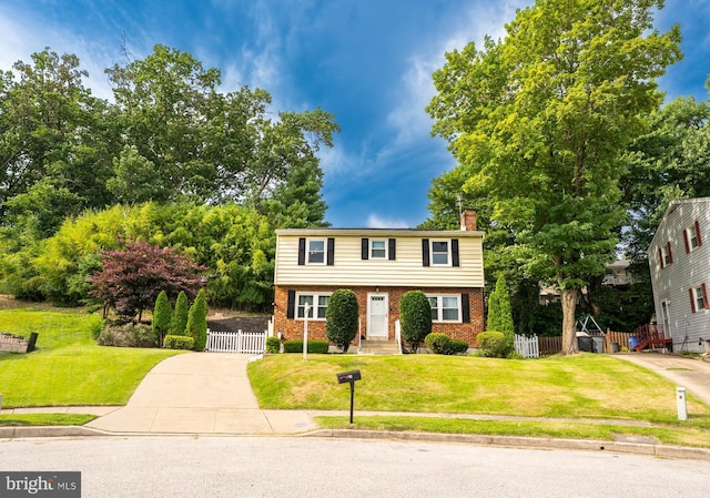 10 Kilkea Ct, Nottingham, MD 21236 - colonial house with a chimney, brick siding, and a gate