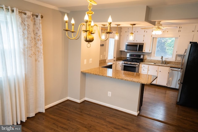 10 Kilkea Ct, Nottingham, MD 21236 - kitchen featuring appliances with stainless steel finishes, dark wood finished floors, white cabinetry, light stone counters, and a peninsula