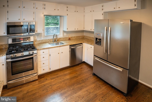 10 Kilkea Ct, Nottingham, MD 21236 - kitchen with appliances with stainless steel finishes, white cabinetry, dark wood-style floors, and light stone counters