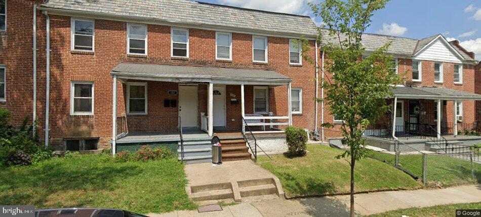 224 N Culver St, Baltimore, MD 21229 - view of property featuring covered porch and brick siding