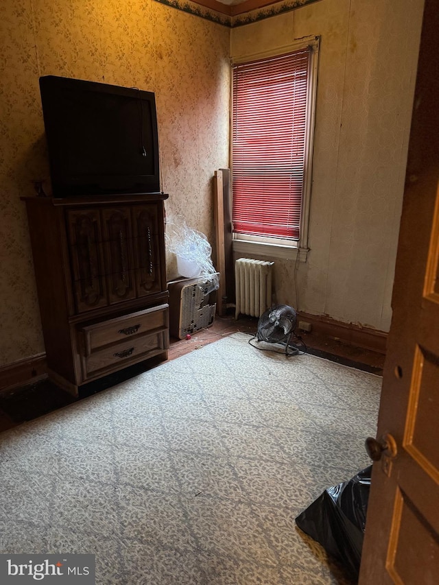 2008 W Lexington St, Baltimore, MD 21223 - bedroom featuring radiator heating unit and wallpapered walls