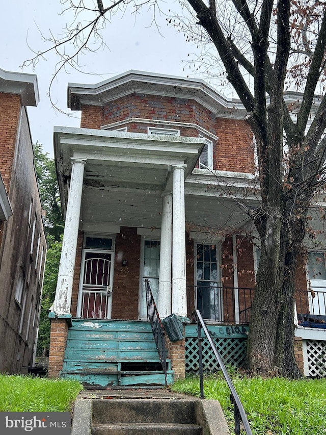 4662 Kernwood Ave, Baltimore, MD 21212 - view of front facade featuring brick siding and a porch