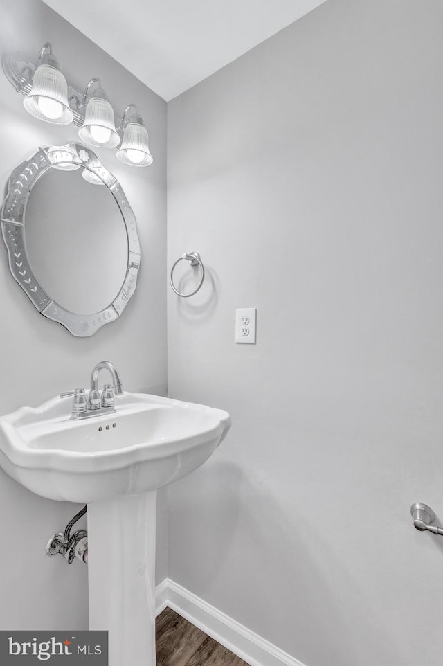 18721 Paprika Ct, Germantown, MD 20874 - bathroom featuring baseboards and wood finished floors