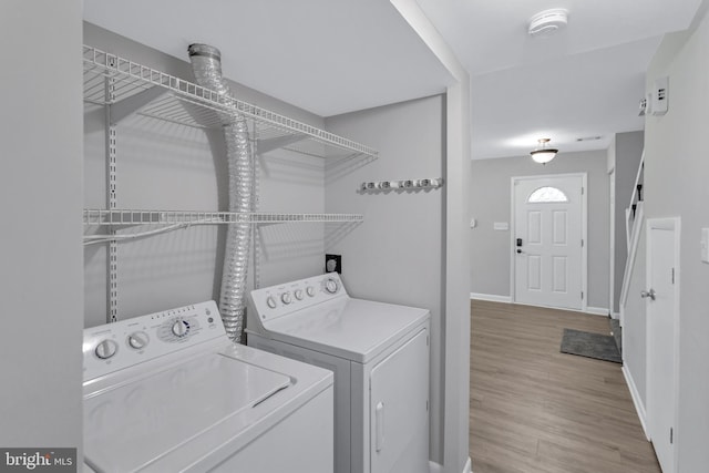18721 Paprika Ct, Germantown, MD 20874 - washroom featuring washer and clothes dryer and wood finished floors