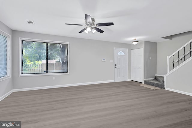 18721 Paprika Ct, Germantown, MD 20874 - entryway with wood finished floors, stairway, healthy amount of natural light, and a ceiling fan