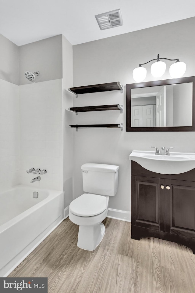 18721 Paprika Ct, Germantown, MD 20874 - full bath with wood finished floors, vanity, and bathing tub / shower combination