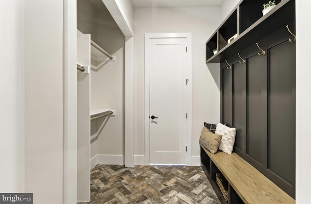 8202 Mockingbird Dr, Annandale, VA 22003 - mudroom featuring baseboards and brick floors
